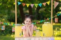 Cute little girl at lemonade stand. Summer refreshing natural drink Royalty Free Stock Photo