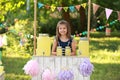 Cute little girl at lemonade stand in park. Summer refreshing natural Royalty Free Stock Photo