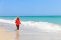 Cute little girl in life jacket on summer beach, safety Royalty Free Stock Photo