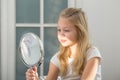 Cute little girl with lipstick applying makeup Royalty Free Stock Photo