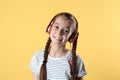 Cute little girl listening to music with headphones Royalty Free Stock Photo