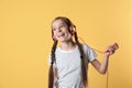 Cute little girl listening to music with headphones Royalty Free Stock Photo