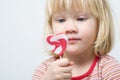 Cute little girl with a lollipop Royalty Free Stock Photo