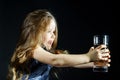 Cute little girl with long hair holding glass of water Royalty Free Stock Photo