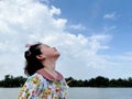 Cute little girl looks into the bright day sky for new opportunities Royalty Free Stock Photo