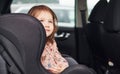 Cute little girl looks through window car. Conception of traveling and vaccation