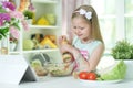 Cute little girl making dinner Royalty Free Stock Photo