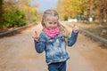 Cute little girl making a rock-n-roll sign