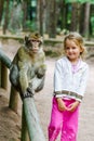 Cute little girl with monkey Royalty Free Stock Photo