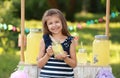 Cute little girl with natural lemonade. Summer refreshing drink Royalty Free Stock Photo