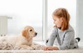 Cute little girl near puppy Royalty Free Stock Photo