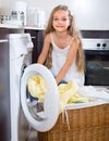 Cute little girl near washing machine Royalty Free Stock Photo