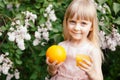 Cute little girl with orange juice and orange fruit, healthy drink Royalty Free Stock Photo