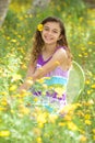 Cute Little Girl Outside in a Flower Field