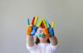 Cute little girl with painted hands Royalty Free Stock Photo