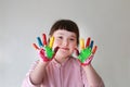 Cute little girl with painted hands. Isolated on the white background Royalty Free Stock Photo