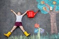 Cute little girl painting with colorful chalks apples harvest from apple tree on asphalt. Cute preschool child with Royalty Free Stock Photo