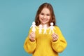 Cute little girl paper chain people which holding in hands, happy family, relationships, childhood. Royalty Free Stock Photo