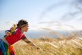 Cute little girl picking grasses Royalty Free Stock Photo