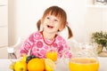 Cute little girl with pigtails sitting and laughing Royalty Free Stock Photo