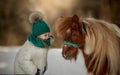 Cute Little girl with pinto pony Royalty Free Stock Photo
