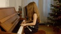Cute little girl plaing grand piano