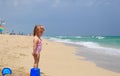 Cute little girl play with sand and water on beach Royalty Free Stock Photo