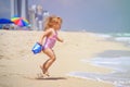 Cute little girl play with water on beach Royalty Free Stock Photo