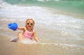 Cute little girl play with water on beach Royalty Free Stock Photo