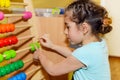 Cute little girl playing with abacus Royalty Free Stock Photo