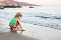 Cute little girl playing on the beach Royalty Free Stock Photo