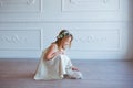 Cute little girl playing with bunny. Spring and easter portrait of beautiful child with rabbit. Royalty Free Stock Photo