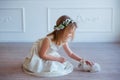 Cute little girl playing with bunny. Spring and easter portrait of beautiful child with rabbit.