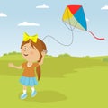 Cute little girl playing with colorful kite outdoor
