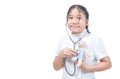CUte little girl playing doctor and listening teddy bear with stethoscope isolated Royalty Free Stock Photo