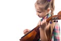 Cute little girl playing on domra. Studio photo