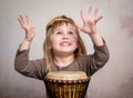 Cute little girl playing drum Royalty Free Stock Photo