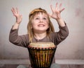 Cute little girl playing drum Royalty Free Stock Photo