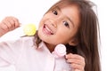 Cute little girl playing, eating sugar jelly sweet candy