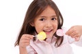 Cute little girl playing, eating sugar jelly sweet candy