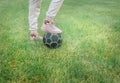 Cute little girl playing football with soccer ball on green lawn in backyard of house. Child kicking soccer ball on Royalty Free Stock Photo