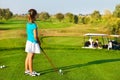 Cute little girl playing golf on a field outdoor Royalty Free Stock Photo