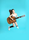 Cute little girl playing guitar Royalty Free Stock Photo
