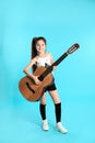 Cute little girl playing guitar Royalty Free Stock Photo