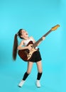 Cute little girl playing guitar Royalty Free Stock Photo