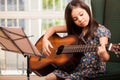 Cute little girl playing the guitar Royalty Free Stock Photo