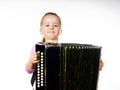 Cute little girl playing harmonica, music education concept