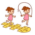 Cute little girl playing hopscotch and jumping rope Royalty Free Stock Photo