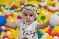 A cute little girl playing in the indoor playground in a shopping centre