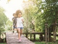 Cute little girl playing outdoor. kid and friend happy play at park. Royalty Free Stock Photo